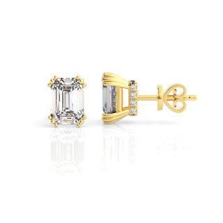 Gold earrings with emerald-cut cubic zirconias