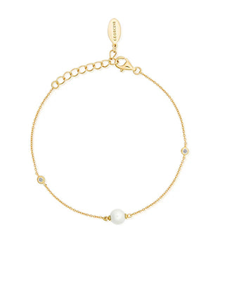 Gold bracelet with a pearl and small crystals on a white background
