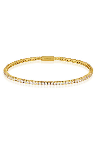 Gold plated silver tennis bracelet with cubic zirconia stones on a white background