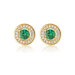 Gold earrings with green gemstones on a white background