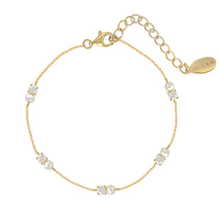 Gold bracelet with pearls and crystals on a white background