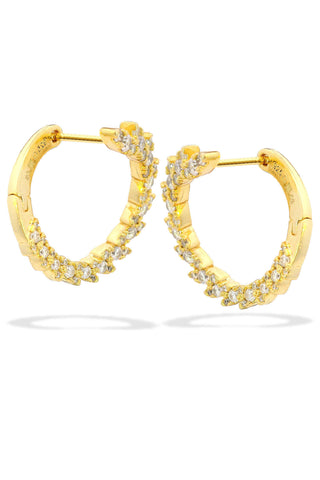 Gold hoop earrings with embedded diamonds on a white background