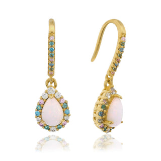 Gold earrings with pink stones on a white background