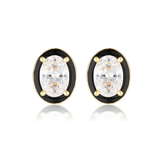 Pair of gold and black earrings with clear gemstones on a white background