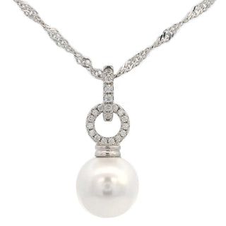 A silver-toned necklace featuring a twisted chain and a pendant with a halo of small clear stones and a single large white pearl, shown on a plain white background.