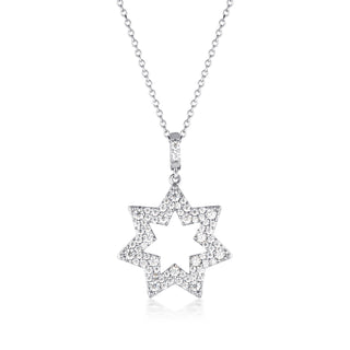 Star-shaped diamond pendant on a chain against a white background