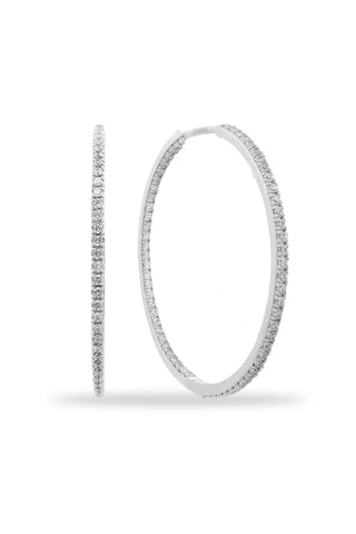 Pair of silver hoop earrings on a white background