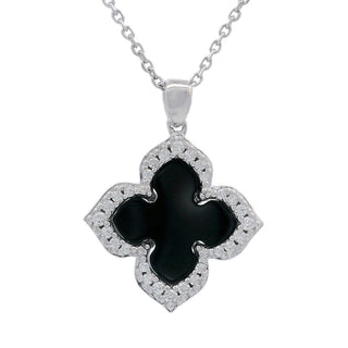 A silver-tone necklace featuring a clover-shaped pendant with a glossy black center and a border of small clear stones, shown against a plain white background.