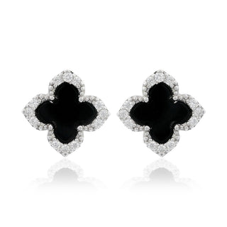 A pair of black and silver four-petal stud earrings, resembling a clover or allover motif, set with small clear stones on a white background with a soft reflection.