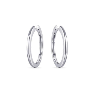 Pair of silver hoop earrings on a white background