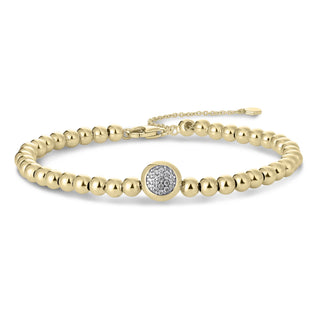 Gold bracelet with a cubic zirconia clasp on a white background