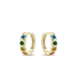 A pair of gold huggie hoop earrings decorated with small rainbow gemstones in blue, green, yellow, orange, and red, set against a plain white background.