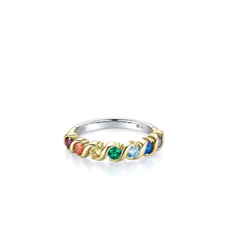 A delicate gold and silver band ring featuring a series of small, colorful gemstones in a rainbow-like sequence, set against a clean white background.