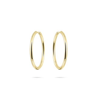 Gold hoop earrings on a white background