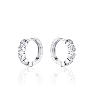 Pair of silver hoop earrings with small stones on a white background