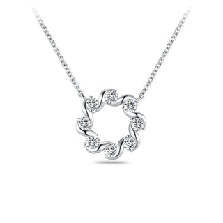 A silver necklace with a circular pendant featuring six clear round-cut gemstones set in a swirled design, suspended from a delicate silver chain against a white background.