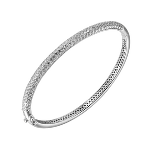 A silver pave bangle with white stone inlays, featuring a slender construction with a rhodium plating for shine and durability.