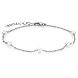 Silver bracelet with pearls on a white background