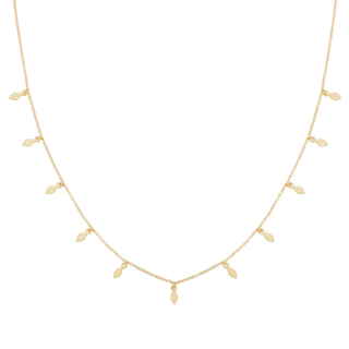 Gold necklace with small leaf-shaped pendants on a white background