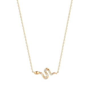Gold snake-shaped necklace on a white background