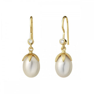 A pair of golden la perle drop earrings with white freshwater pearl and white zirconia accents.
