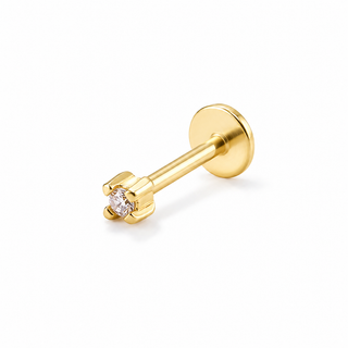 A gold labret stud earring with a single round-cut clear gemstone in a prong setting, shown on a clean white background.