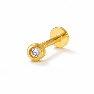 A gold barbell stud piercing jewelry piece with a round clear gemstone set in the front ball, shown on a clean white background.