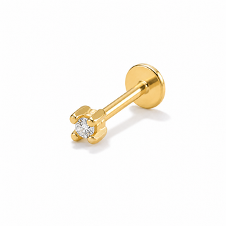 A gold body jewelry stud with a round clear gemstone in a four-prong setting, shown on a clean white background.