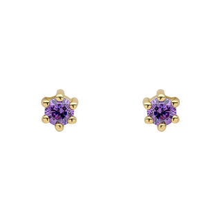 A pair of gold flower-shaped stud earrings with round purple gemstones in a prong setting, shown on a plain white background.