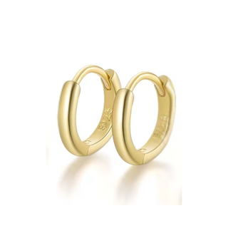 Gold hoop earrings on a white background