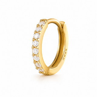 A gold huggie hoop ring featuring a row of round-cut clear gemstones along the front, with a polished 585 sterling gold interior, shown on a clean white background.