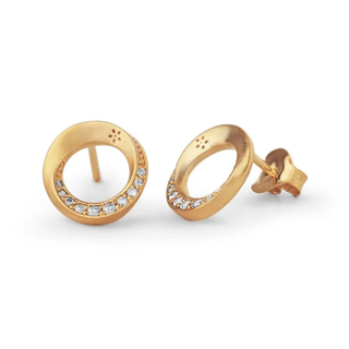 Gold earrings with circular design and embedded stones on a white background