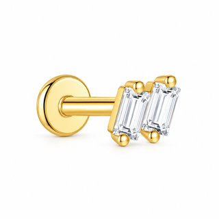 A single gold post and ring stud earring with two clear baguette-cut gemstones, shown on a clean white background.