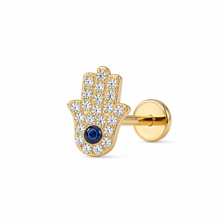 A gold Hamsa hand stud earring paved with clear cubic zirconia stones and featuring a central dark blue evil eye, shown on a clean white background.