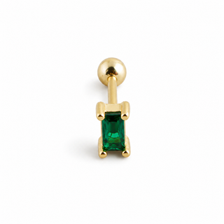 A gold-plated labret piercing stud featuring a rectangular green emerald-cut gemstone in a prong setting, shown on a clean white background.