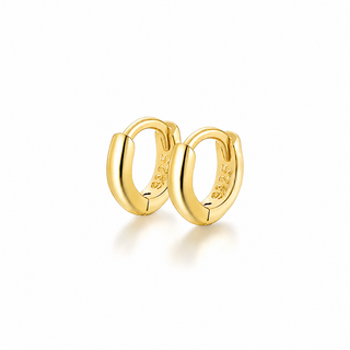 A pair of polished yellow gold huggie hoop earrings with a 925 sterling silver hallmark stamped on the inside, shown on a clean white background with a soft reflection.