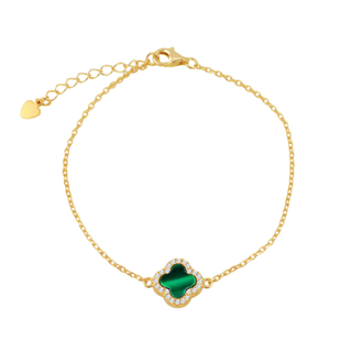 Gold bracelet with a green clover-shaped charm on a white background