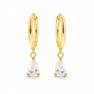 A pair of gold huggie hoop earrings with dangling pear-cut clear gemstones, shown on a clean white background.