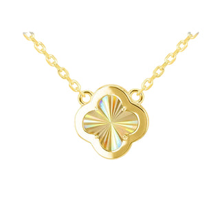 A gold necklace with a four-leaf clover pendant featuring a colorful iridescent inlay, displayed against a soft gray gradient background.