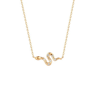 Gold snake-shaped necklace with diamond accents on a white background