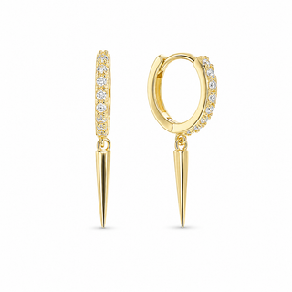 A pair of gold huggie hoop earrings with a vertical bar studded with small clear stones and a pointed spike dangle, shown on a plain white background.