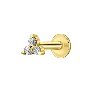 Gold earring with three clear gemstones on a white background