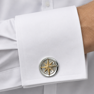 Cufflink with star design on a white shirt cuff