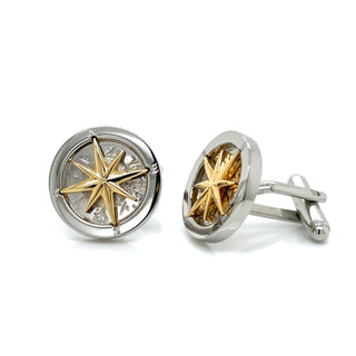Gold and silver compass cufflinks on a white background