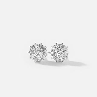Pair of diamond earrings on a light gray background