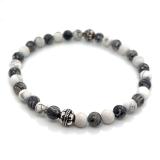 Beaded bracelet with black, white, and gray stones on a white background