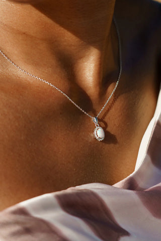 Necklace with a pendant on a person's neck