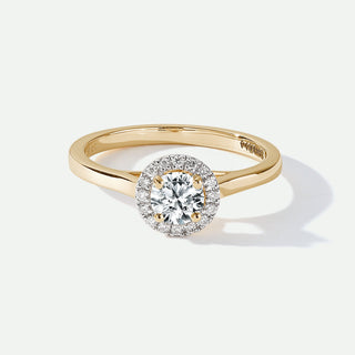 Gold ring with a diamond on a white background