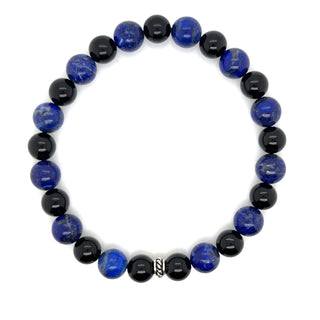 Bracelet with blue and black beads on a white background