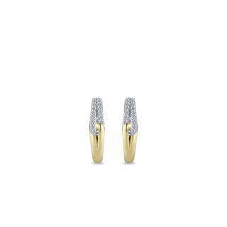 Gold hoop earrings with embedded diamonds on a white background